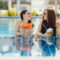 Two Girls Tanning Having Fruit By Pool